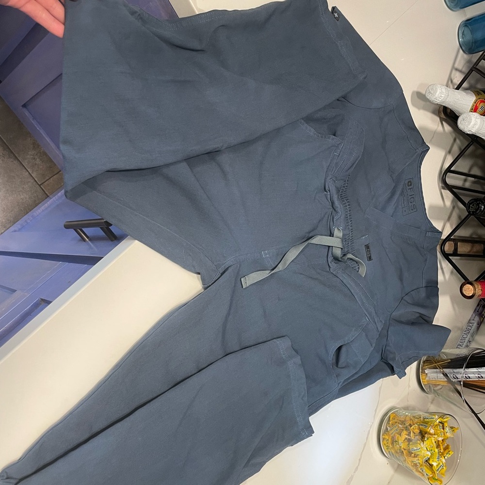 Figs scrub set small. Has some  stains.